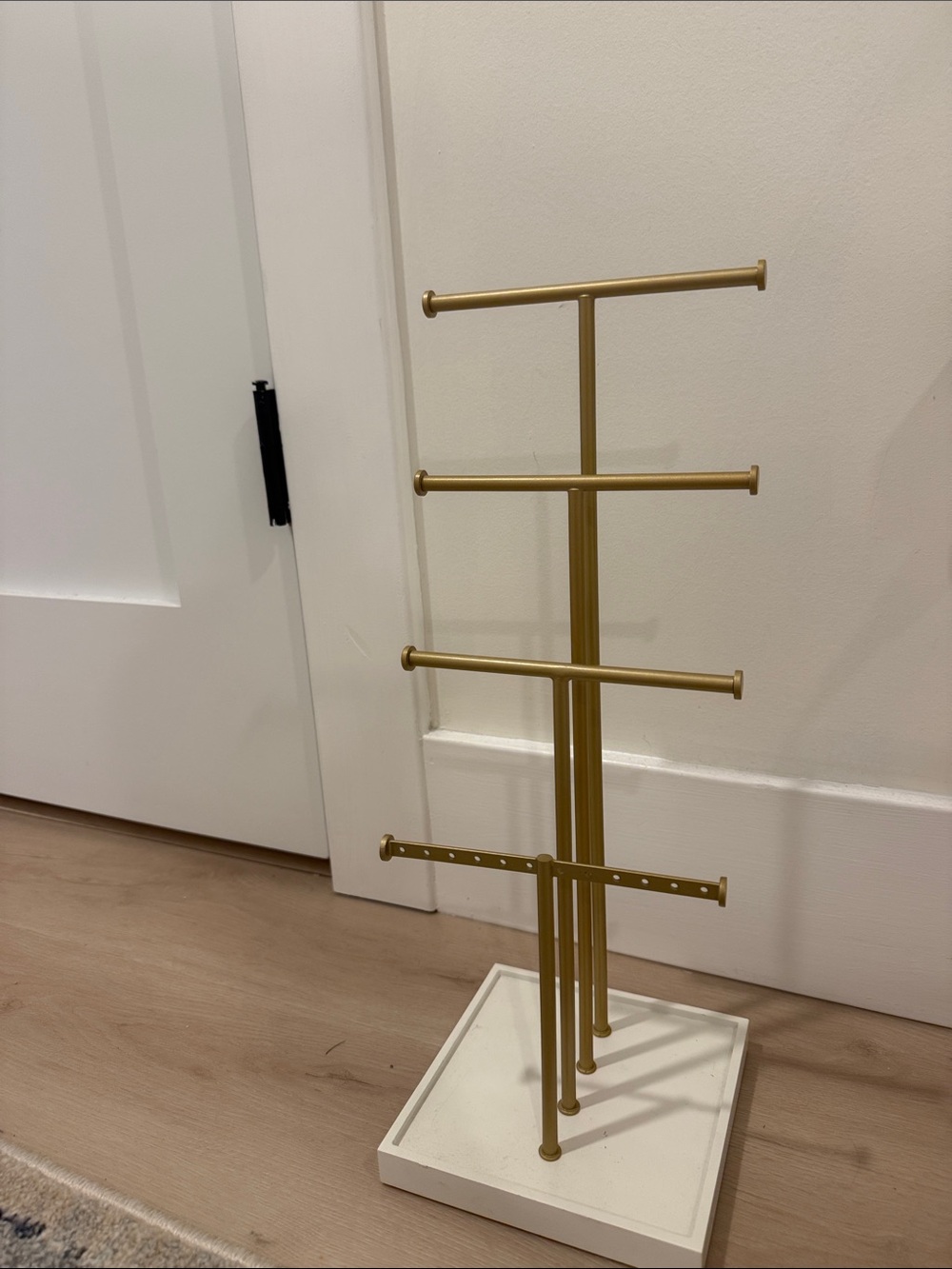 Gold Jewelry Stand on White Base